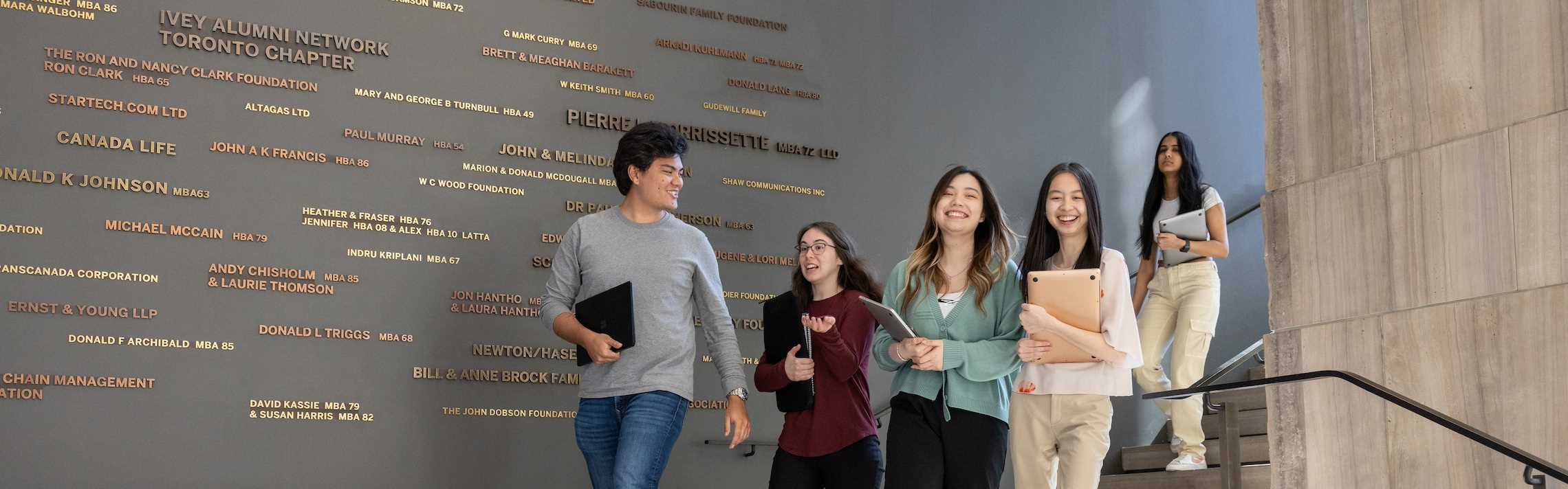 Students in front of donor wall